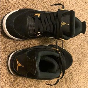 Air Jordan 4 retro “Royalty” black and gold.
